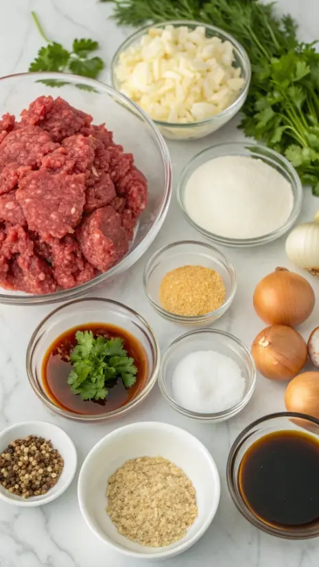 Ingredients for Salisbury steak including ground beef, breadcrumbs, onion, and spices.