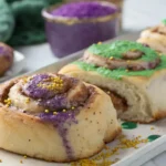 Mardi Gras cinnamon rolls with colorful icing